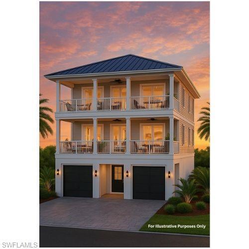 Image 2: View of front of house featuring driveway, an attached garage, a metal roof, and a balcony