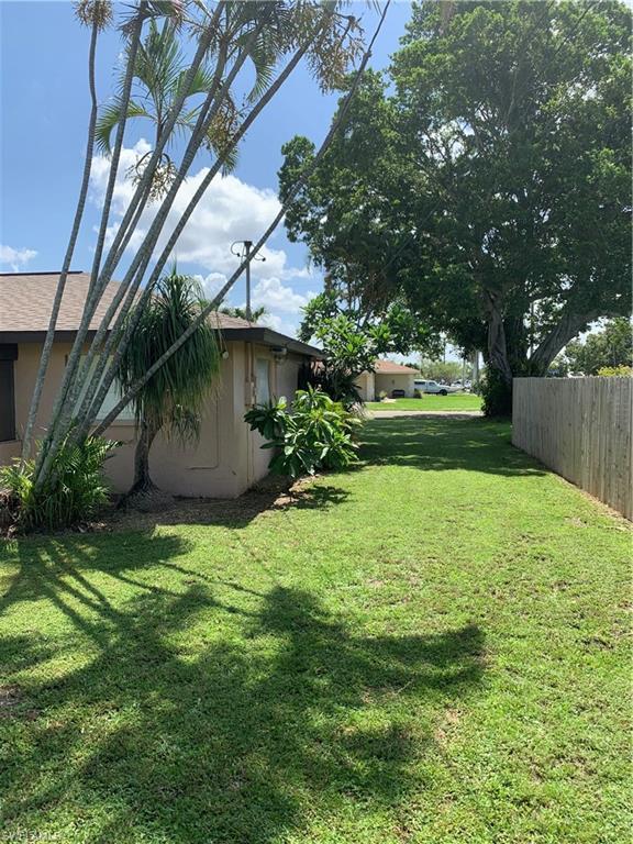 Image 3: View of yard with fence