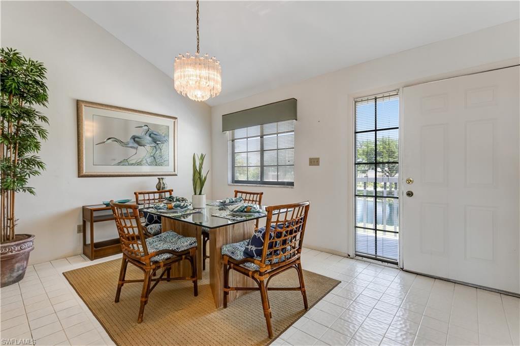 Image 2: Screened lanai with marina and  water views.
