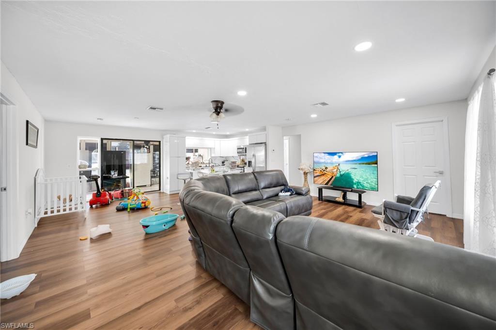 Image 4: Living room with recessed lighting, wood finished floors, and a ceiling fan