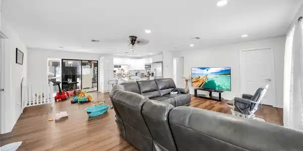 Image 4: Living room with recessed lighting, wood finished floors, and a ceiling fan
