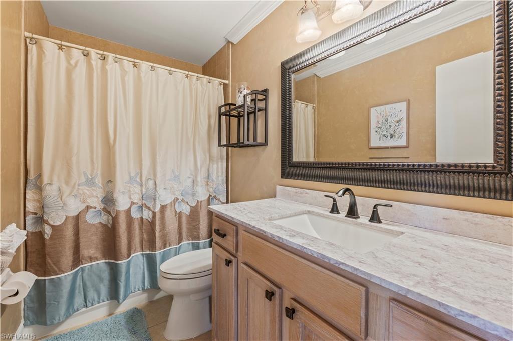 Image 4: Bathroom with vanity, tile patterned flooring, and a shower with curtain