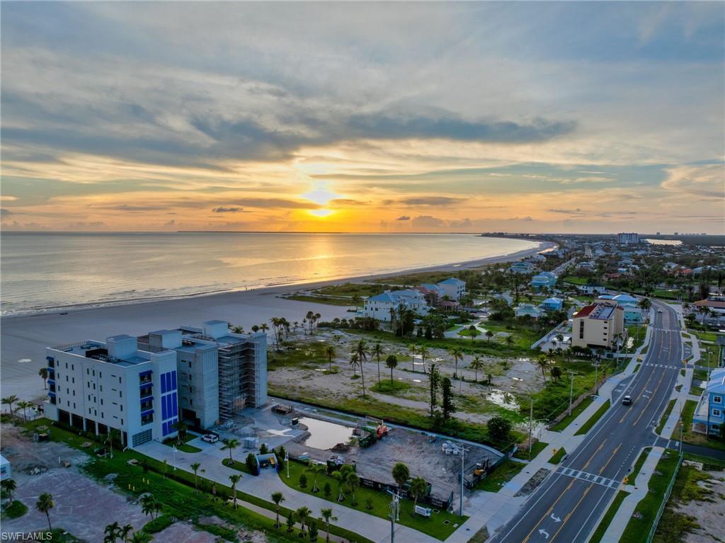 Image 1: Aerial view at dusk of view of water and beach