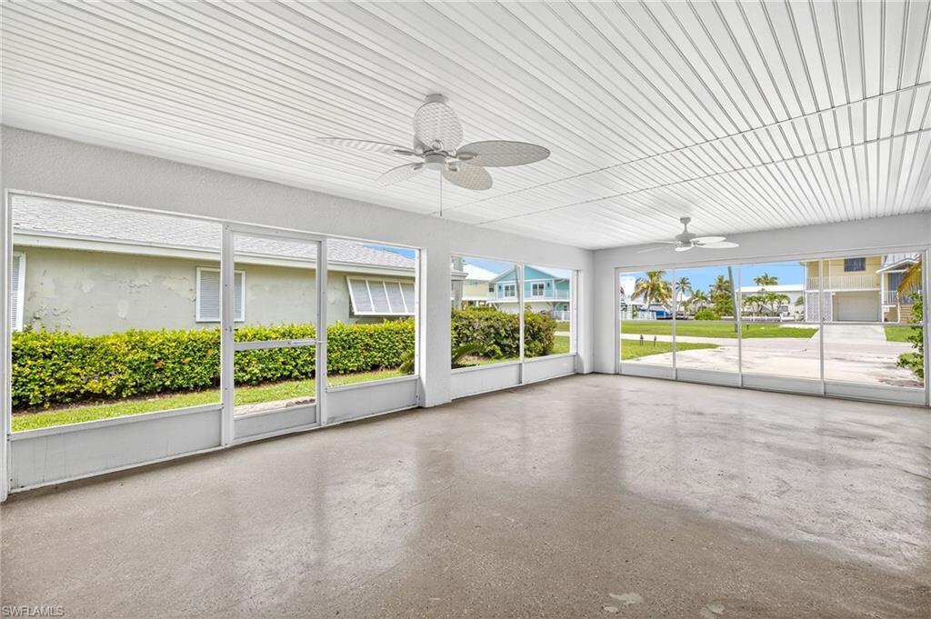Image 3: Unfurnished sunroom with a ceiling fan
