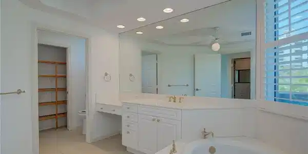 Image 2: Full Principal bathroom featuring recessed lighting, light tile patterned floors, a bath, vanity, and a ceiling fan