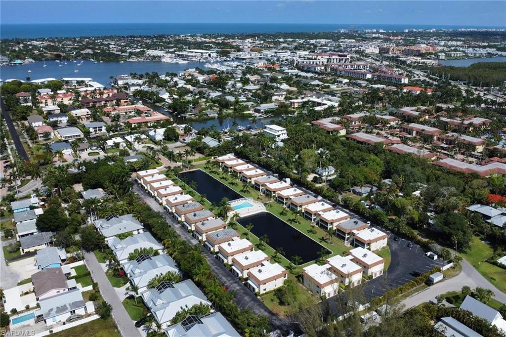 Image 2: Aerial view of property's location featuring a large body of water