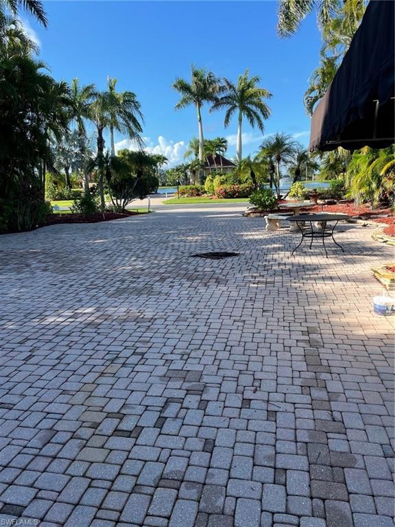 Image 4: View of property's community with a patio