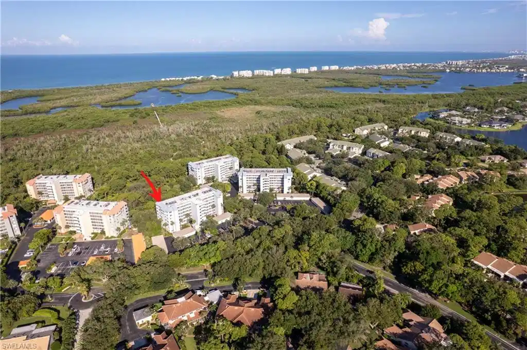 Image 1: Aerial view of building, looking toward boardwalk and Gulf