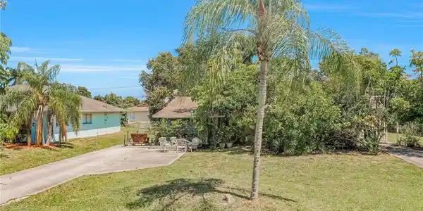 Image 2: View of front facade featuring a front yard and a patio area