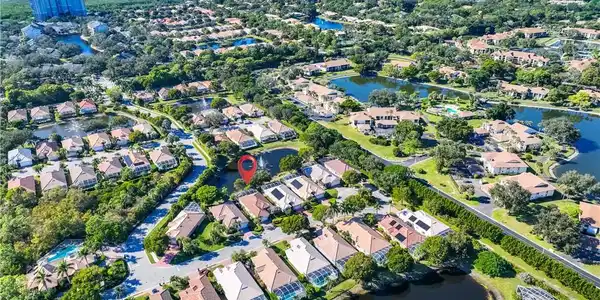 Image 3: View of property location with a large body of water and nearby suburban area