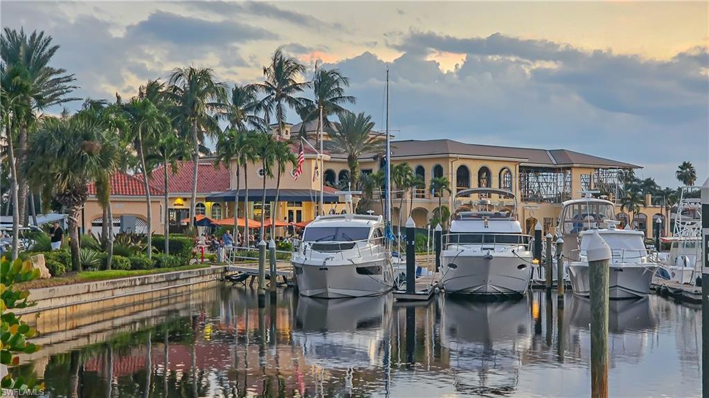 Image 3: Dock area featuring a water view and boat lift