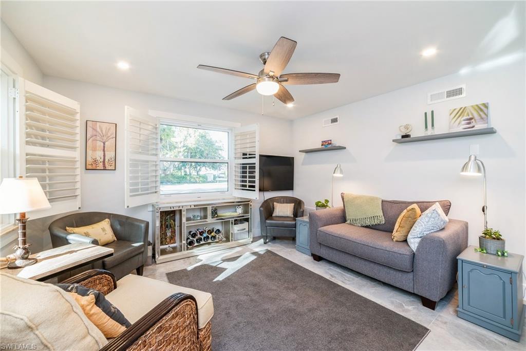 Image 3: Living area featuring a ceiling fan and recessed lighting