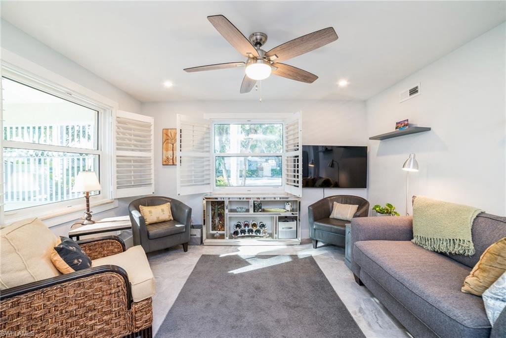 Image 4: Living area featuring ceiling fan