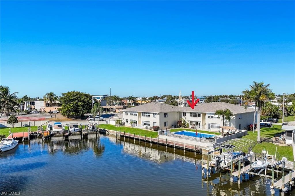 Image 3: Water view with a boat dock and boat lift
