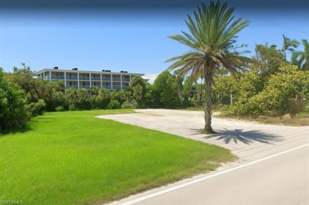 Image 4: cleared lot with a.i. grass/tree