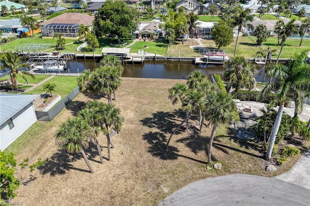 Image 2: View of property location featuring a nearby body of water and nearby suburban area