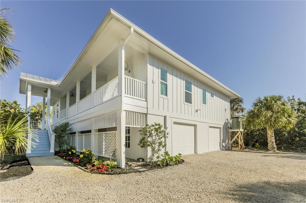 Image 2: View of home's exterior featuring a garage and a balcony