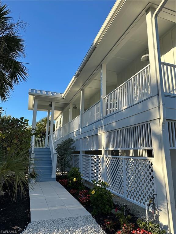 Image 3: View of property exterior with stairs