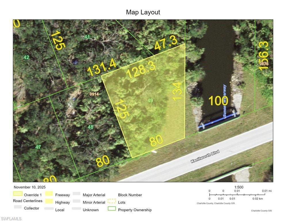 Image 1: Aerial overview of property's location featuring property boundaries highlighted