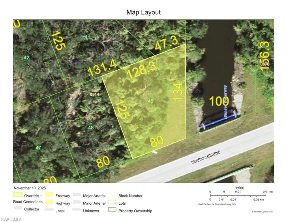 Image 1: Aerial overview of property's location featuring property boundaries highlighted