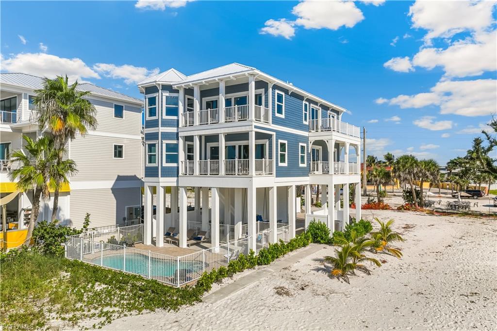 Image 4: Rear view of house featuring a metal roof