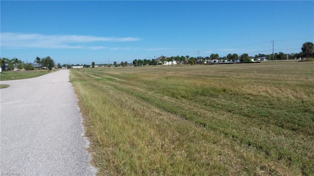 Image 4: View of asphalt road with a view of countryside