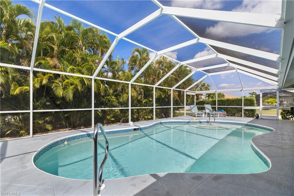 Image 2: Walk around pool area.  Large lanai to the right.