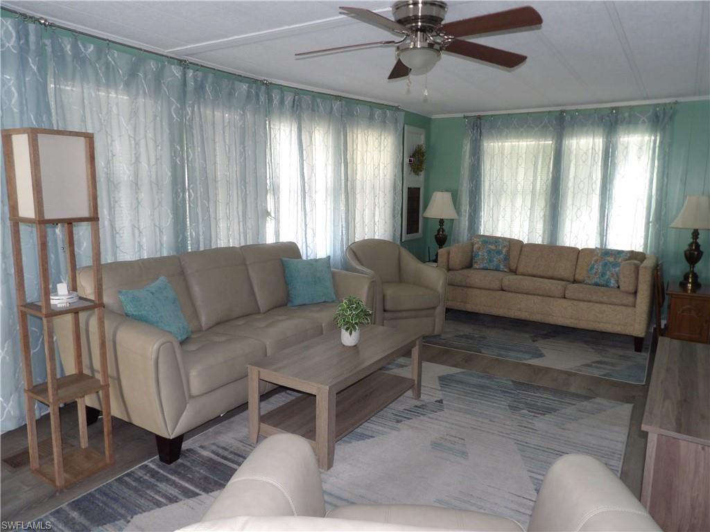 Image 4: Living area featuring ceiling fan and wood finished floors
