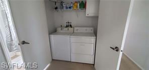 Image 4: Washroom with washer and clothes dryer and baseboards