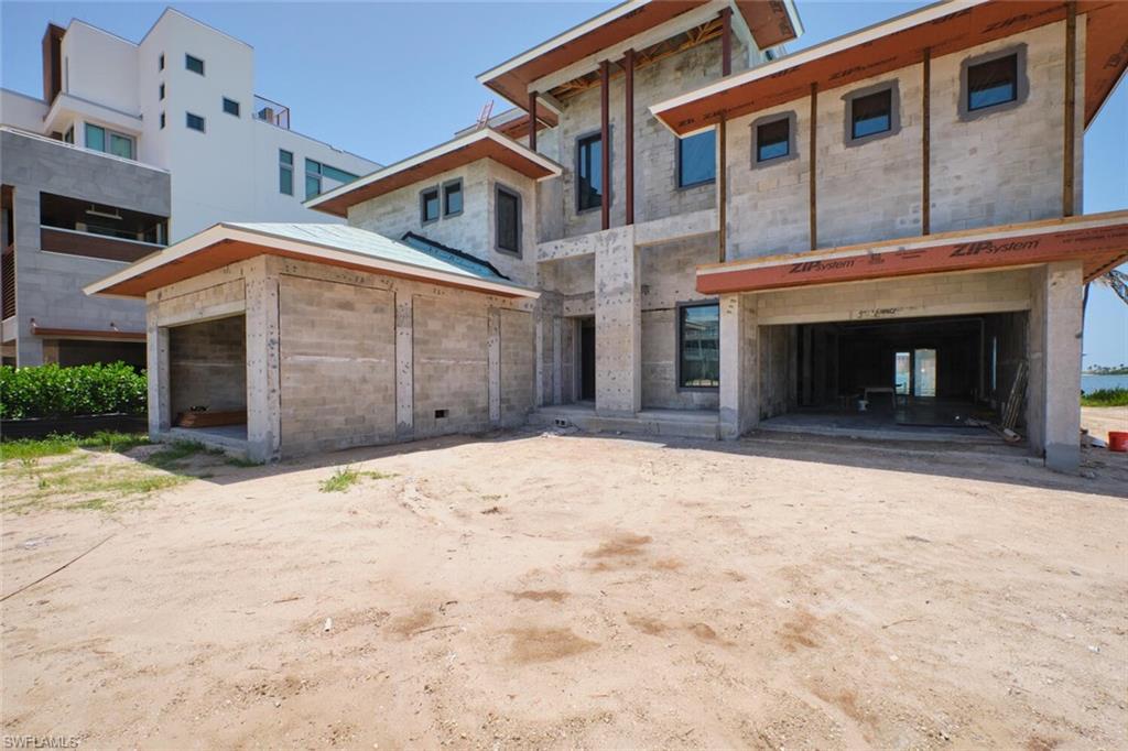 Image 3: View of front of house with a garage