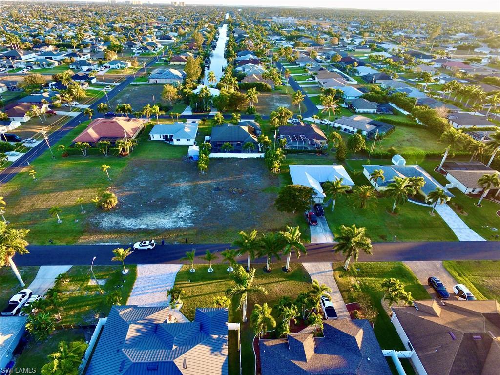 Image 4: Aerial overview of property's location featuring nearby suburban area
