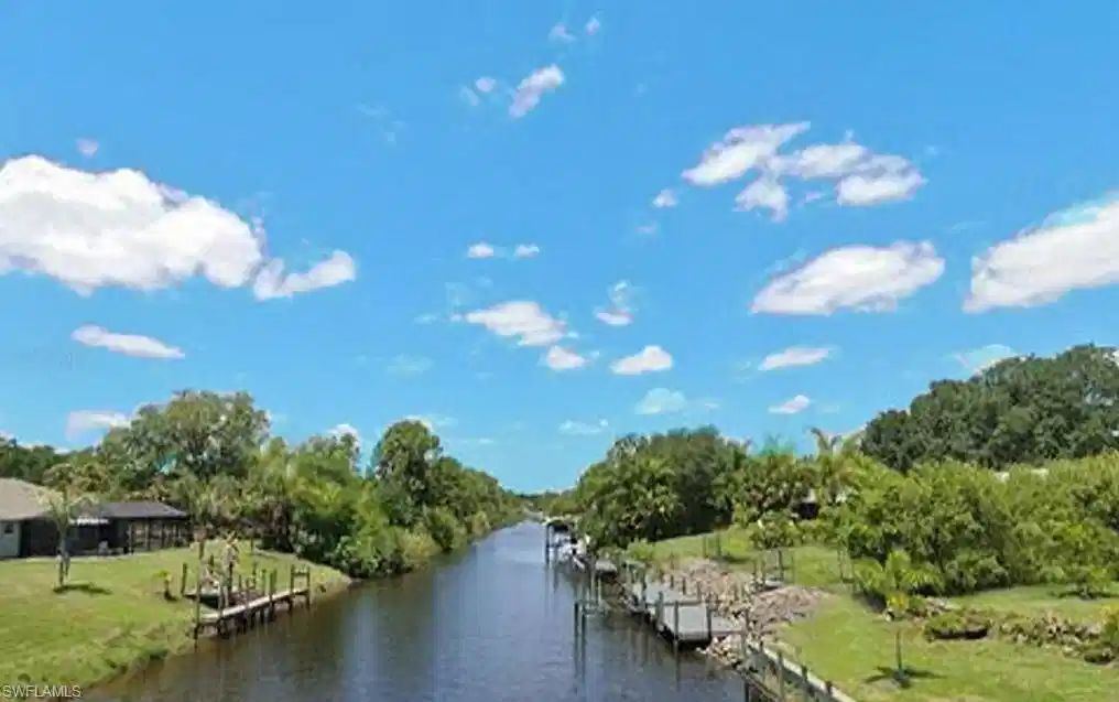 Image 1: Water view with a boat dock