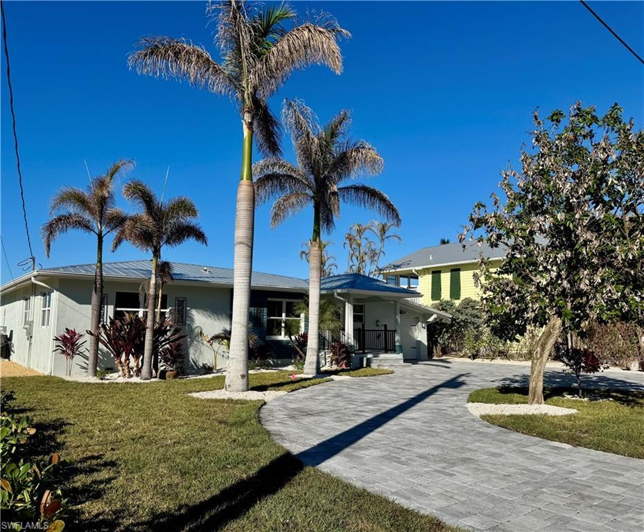 Image 4: View of front of property featuring a front yard