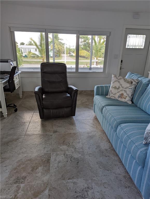 Image 3: Living room with a desk