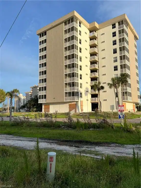 Image 1: View of apartment building / complex