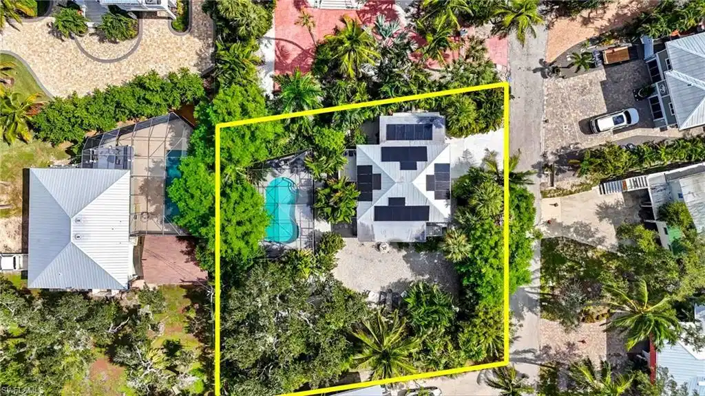 Image 1: Aerial view of property, yard and a pool area - Virtually Edited Image