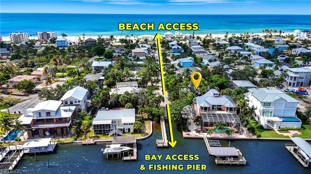 Image 3: Aerial view of residential area with a nearby body of water - Virtually Edited Image