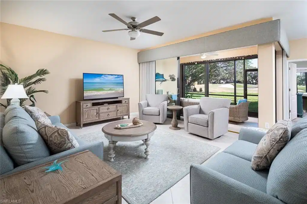 Image 1: Living room with tile patterned flooring and a ceiling fan