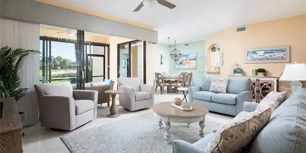Image 2: Living room featuring visible vents, ceiling fan, and light tile patterned flooring