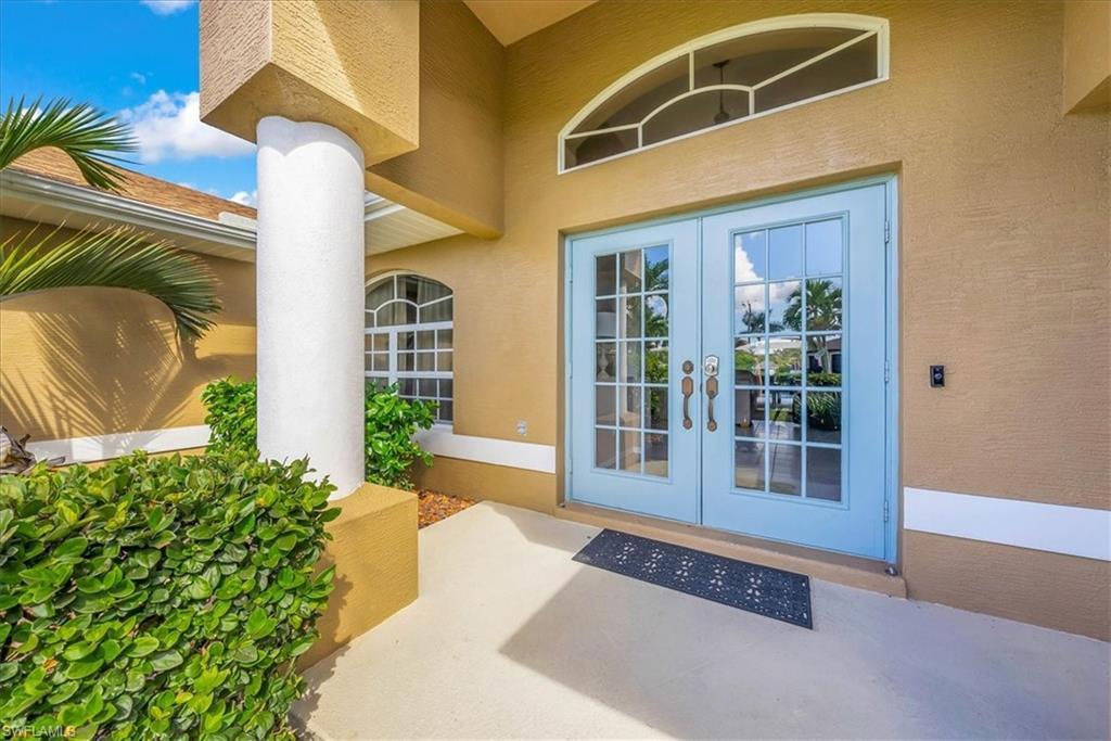 Image 4: Property entrance featuring stucco siding, french doors, and a patio area