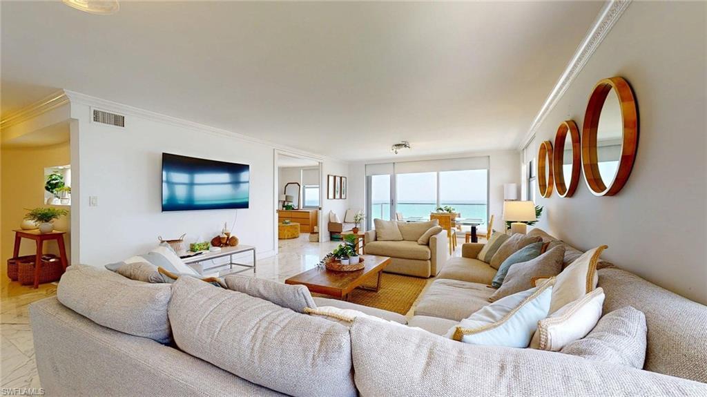 Image 4: Living area with crown molding