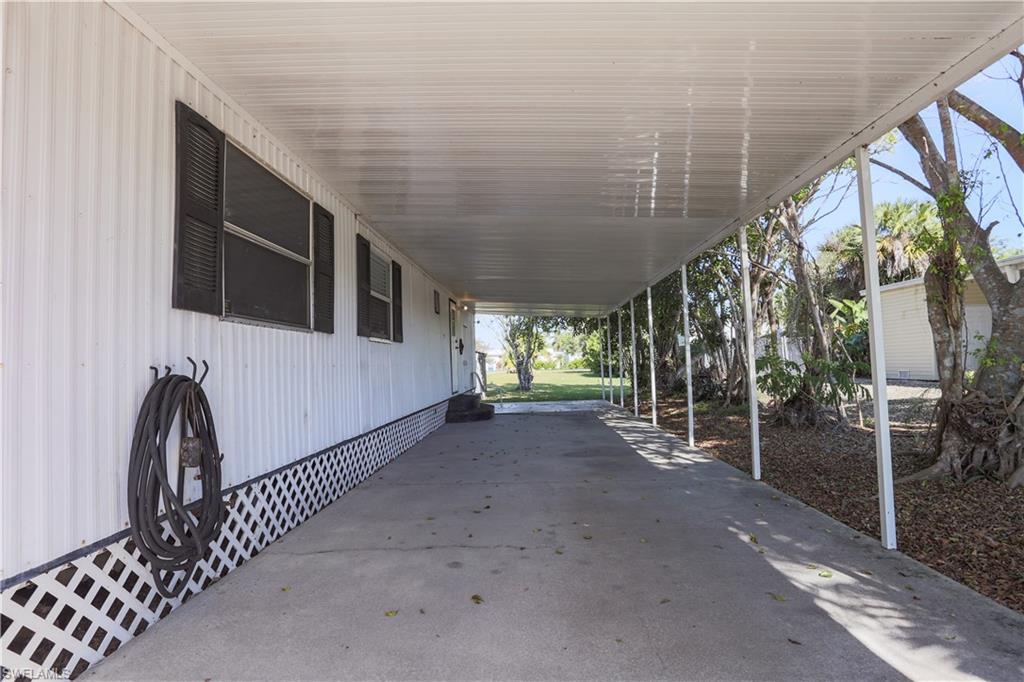 Image 3: View of patio / terrace featuring a carport