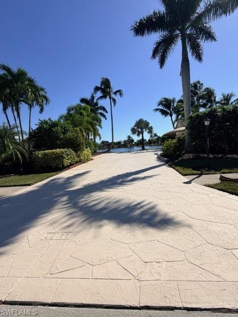 Image 1: View of road featuring street lights