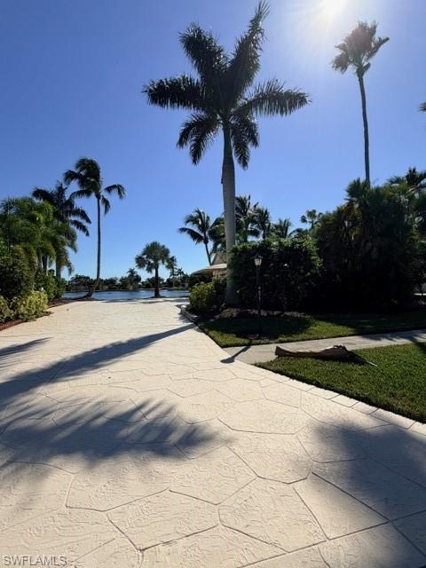 Image 2: View of concrete driveway with street lights