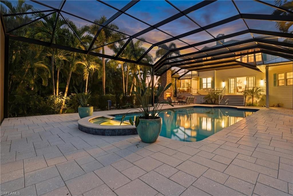 Image 4: Integrated pool / spa with a lanai, a patio, and a sunroom