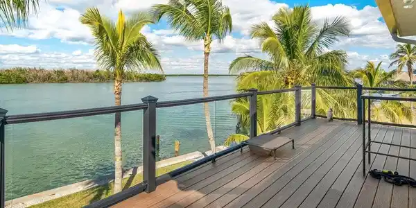 Image 4: Wooden terrace featuring a water view