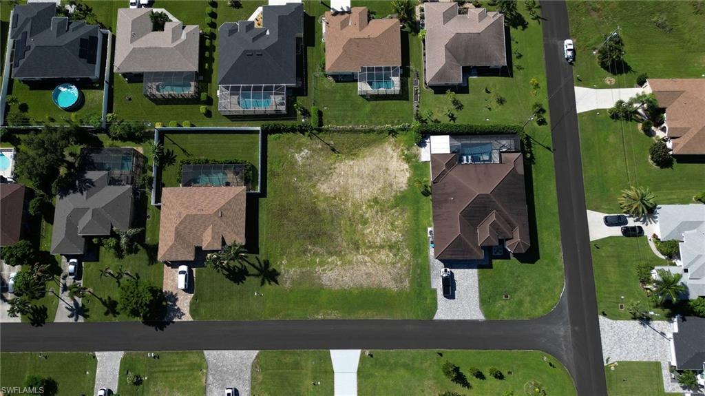 Image 2: Aerial overview of property's location with nearby suburban area