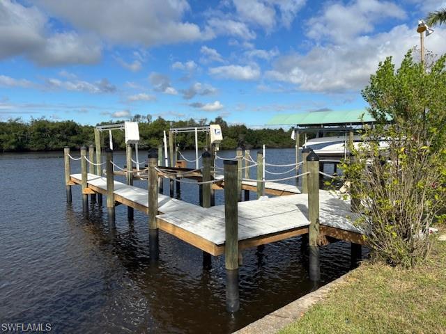 Image 3: Dock with boat lift and a water view