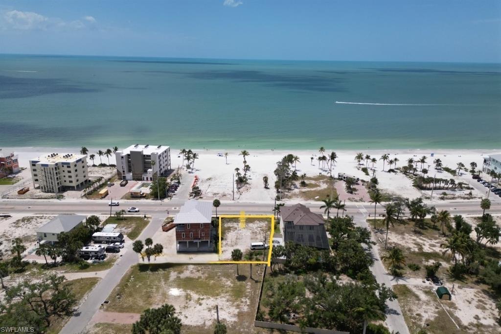 Image 4: Aerial view of property's location with property parcel outlined and extended coastline