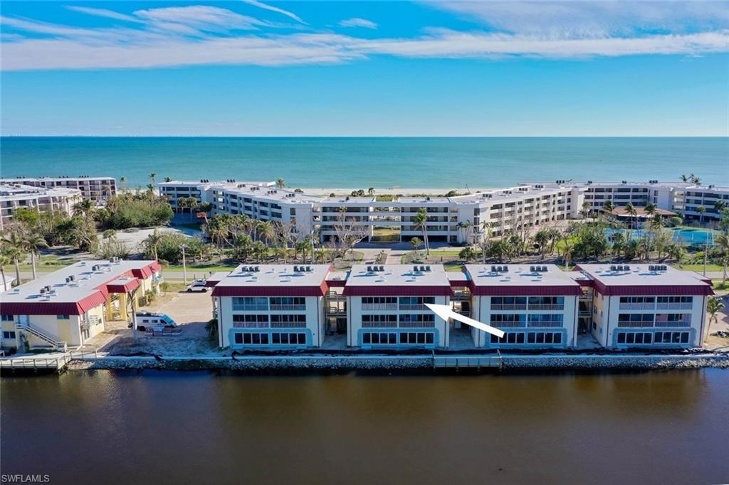 Image 2: Aerial view of apartment complex / building and a large body of water